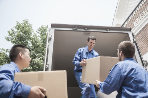 Loading furniture and boxes into a removal truck in a South London street