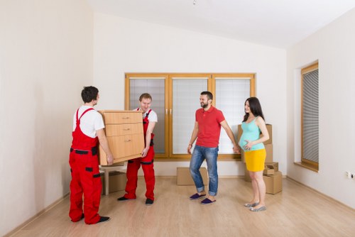 Professional house removals service with boxes and furniture in transit